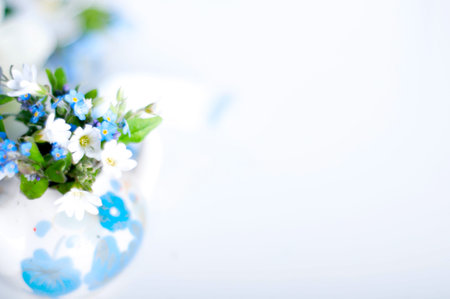 Books and wildflowers on napkin on wooden table on wooden wall backgroundの写真素材