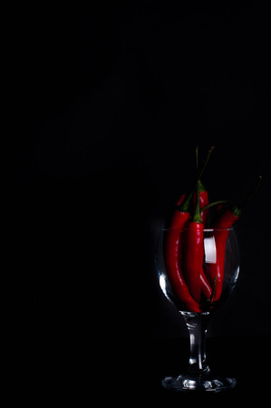 Red chili pepper on a black backgroundの写真素材