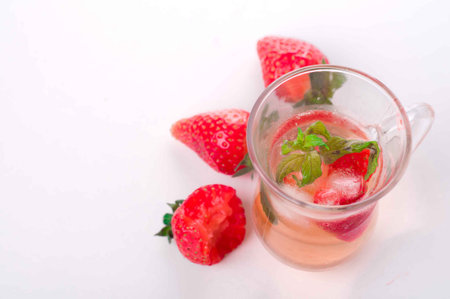 Strawberry lemonade with ice in glassの写真素材