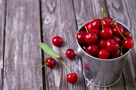 delicious fresh cherries on grey wooden tableの写真素材