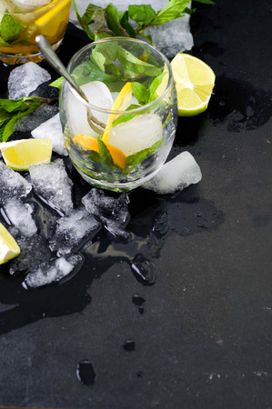 Mojito cocktail with fresh limes on a black backgroundの写真素材