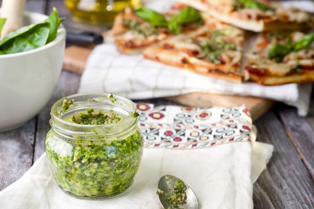 Savory roasted tomatoes, pesto and goat cheese pizzaの写真素材