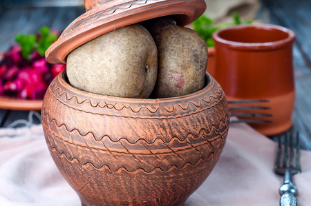 Baked potatoes are a delicious fresh vegetables on a white background.の写真素材