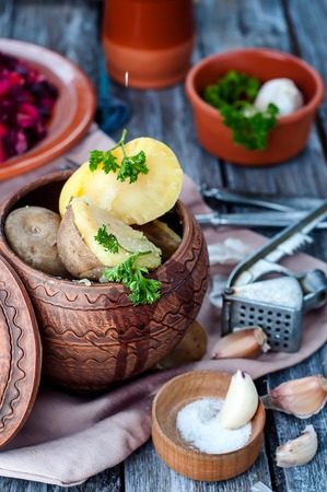 Baked potatoes are a delicious fresh vegetables on a white background.の写真素材