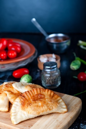 Fresh baked  pasties filled with meat and vegetablesの写真素材