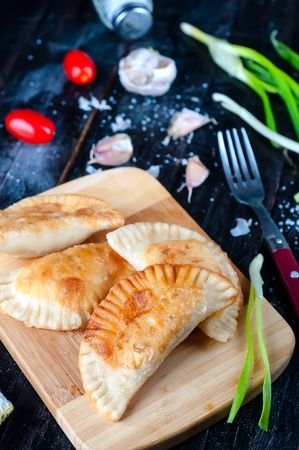 Fresh baked  pasties filled with meat and vegetablesの写真素材