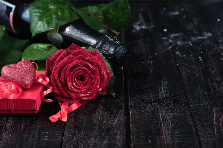 Valentine's day roses and champagne over dark backgroundの写真素材