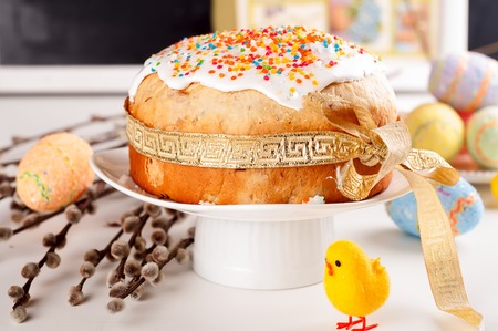 Easter cake and colorful eggs on festive Easter tableの写真素材