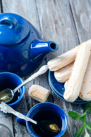 Tea set, herbal tea and cookies Savoiardiの写真素材