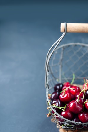 Cherries on wooden table with water dropsの写真素材