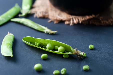 snow peas cooked, food background in greenの写真素材
