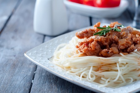 Delicious spaghetti with bacon alla carbonara on wooden tableの写真素材