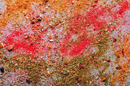 scattered on the table different spices on gray tableの写真素材