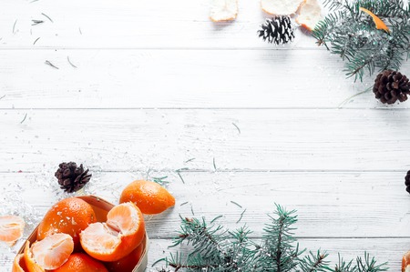 new year composition in basket with mandarins and fir tree on a wood white background. Copy-spaceの写真素材
