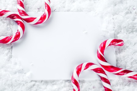 Child letter to Santa Claus. candy sticks and paper with place for greetingの写真素材