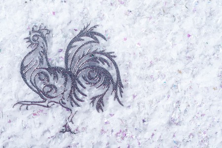 Rooster is a symbol of 2017. Decoration toy on a Christmas background. Christmas card.の写真素材