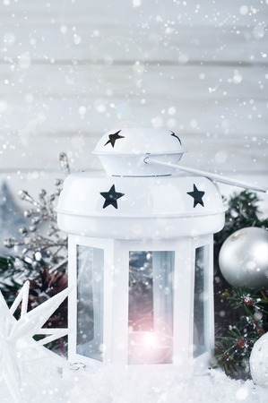 Christmas and New Year background with Christmas candle lantern and Christmas decorationsの写真素材