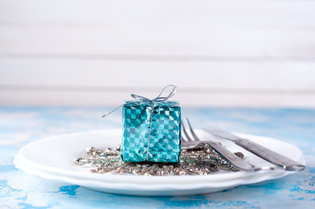festive table setting for christmas in the blue background. Space for textの写真素材