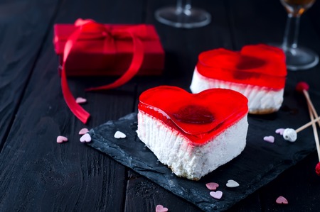 Beautiful red heart for valentine day on wooden deskの写真素材