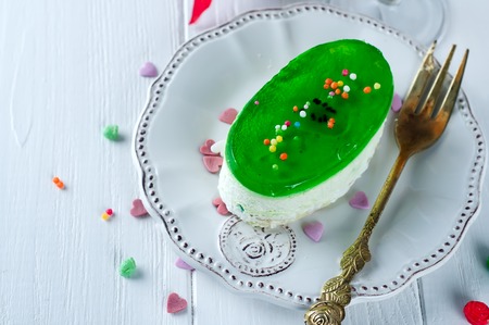 delicious piece of cheesecake on white wooden backgroundの写真素材