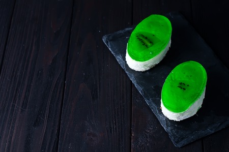 delicious piece of cheesecake on wooden backgroundの写真素材