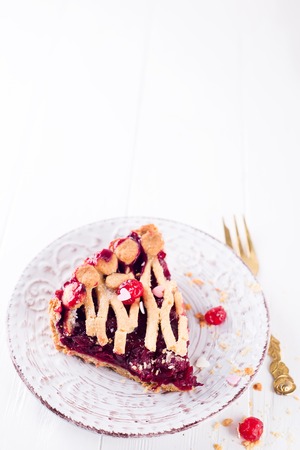 Delicious Homemade Cherry Pie with a Flaky Crust on white wooden background, copy spaceの写真素材