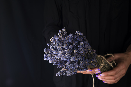 woman creating bouquet of natural lavender flowers,の写真素材