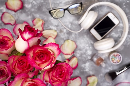 composed of the roses and mobile phone on the back of a blurry backgroundの写真素材