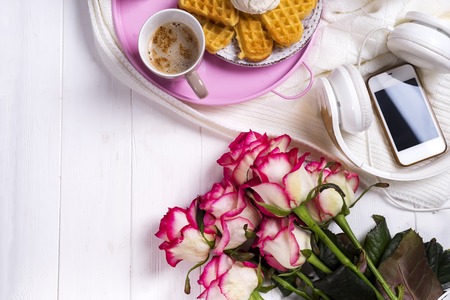 Coffee with waffles and roses. Valentines Day or 8 march . Delicious Breakfast.の写真素材