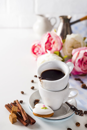 Coffee cup and beans on a white background.の写真素材