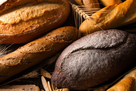 Top view shot of a table full of different kinds of freshly baked bread
