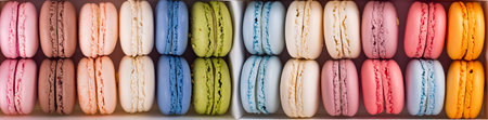 Colorful french macaroons flat lay. Pastel colors pink, green, yellow macarons with copy space, top...
