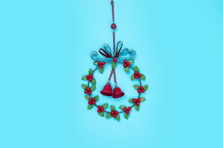 Winter and Christmas metal wreath isolated on blueの写真素材
