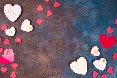 Beautiful valentines day background with red hearts on stone background with copy space, flat lay
