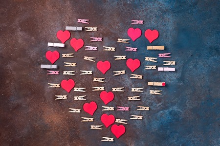 red hearts and clothespins made heart isolated on stone background - Valentines day conceptの写真素材