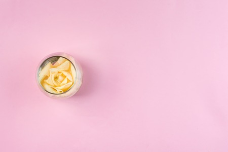 White roses in jars on a pink background with copy space, fla layの写真素材