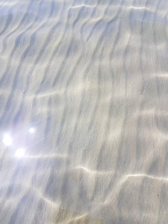 Nature water surface with sun reflection.の写真素材