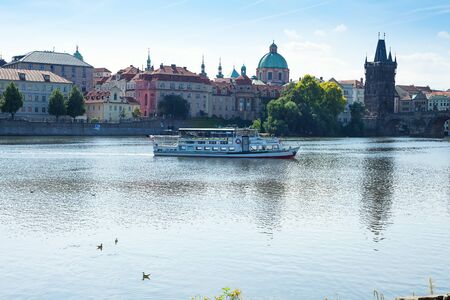 Prague, Czech Republic - Jule 19, 2018: Bright and beautiful summer view on Vltava river and tourists shipsのeditorial素材