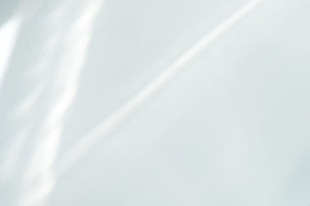 White background from sunlight rays through wall