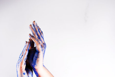 Classic blue glittering palms. Fashion inspired by blue metallic trend. Copy space