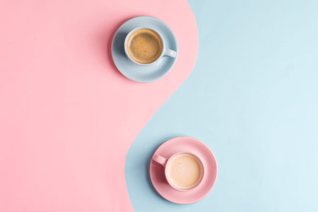 Creative pastel blue pink  as a symbol of infinity with two ceramic cups of freshly brewed coffee...