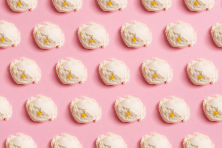 Seamless pattern of balls of natural vanilla ice cream on a pink backgroundの写真素材
