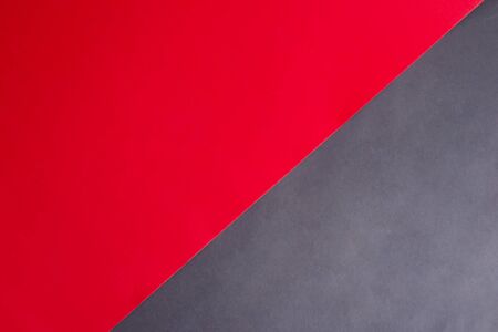 Creative handcraft card as a duotone diagonal papercraft background for your creativity in black and red colors.の写真素材