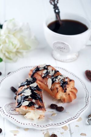 Tasty eclairs on tableの写真素材