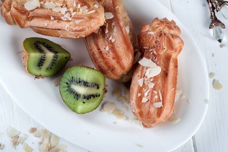 Tasty eclairs on tableの写真素材