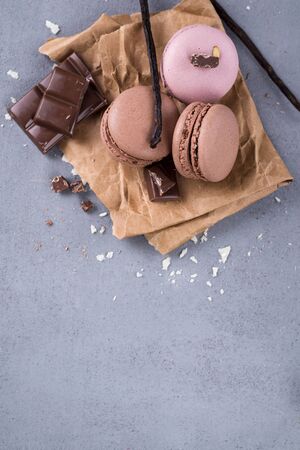 French macaroons with mint, chocolate and vanilla on a stone backgroundの写真素材