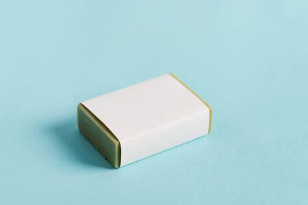 Soap wrap Box Mock-up package with bar olive soap isolated on blue backgroundの写真素材