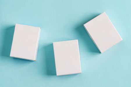Set from three paper mock up boxes for packaging products and things on a pastel blue background.の写真素材