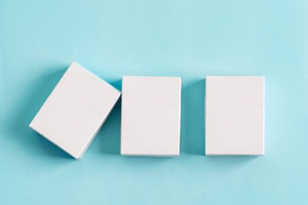 Set from three paper mock up boxes for packaging products and things on a pastel blue background.の写真素材
