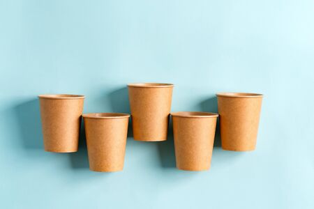 Zero Waste eco friendly paper disposable mockup cups above pastel blue background.の写真素材